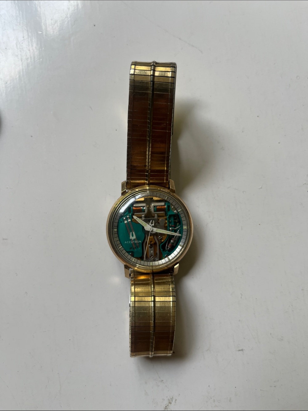 Bulova Gold Tone Bracelet Watch with Teal Open-Work Dial